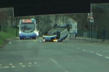 A car landed on its roof in a collision on Firth Park Road, Sheffield, this afternoon