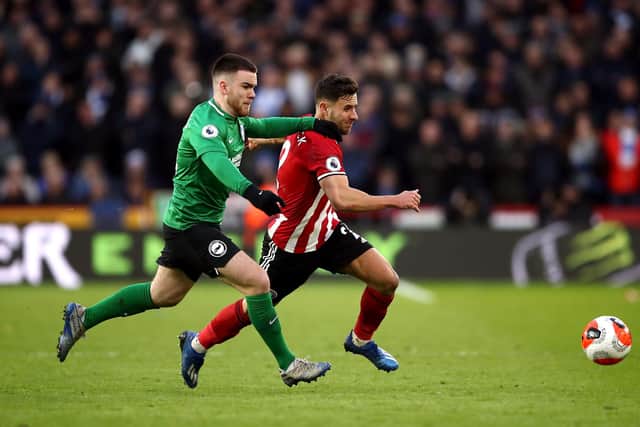 Brighton and Hove Albion's Aaron Connolly (left) and Sheffield United's George Baldock battle for the ball during the Premier League match at Bramall Lane, Sheffield: Tim Goode/PA Wire.