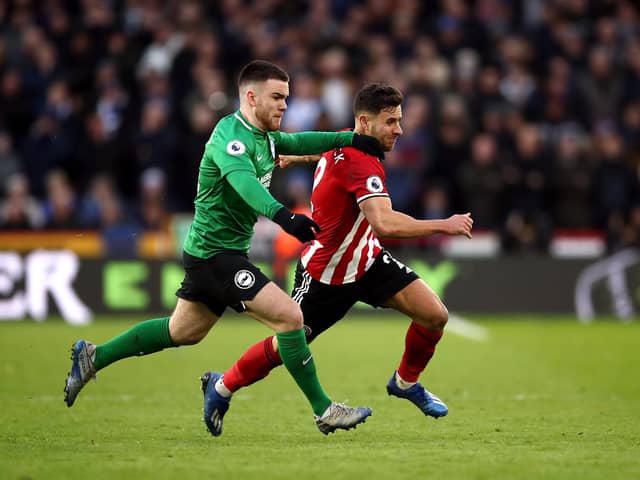 Brighton and Hove Albion's Aaron Connolly (left) and Sheffield United's George Baldock battle for the ball during the Premier League match at Bramall Lane, Sheffield: Tim Goode/PA Wire.