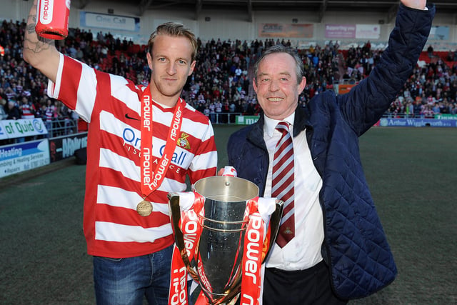 James Coppinger and manager Brian Flynn celebrate promotion
