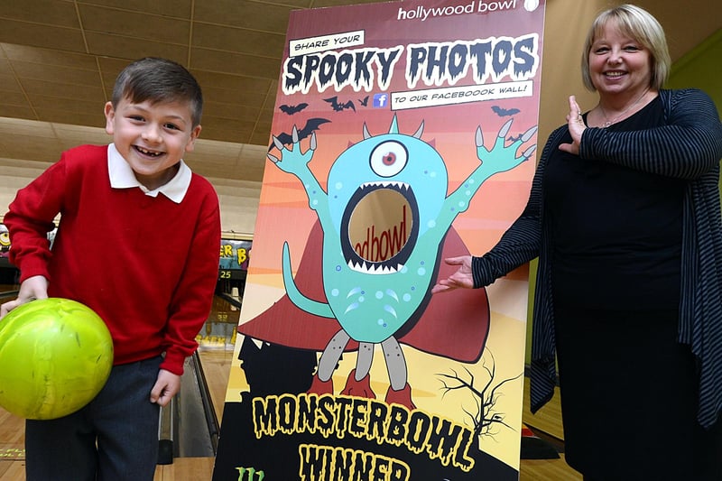 Seven-year-old Alex Mendoza, of Rawmarsh, won a game of bowling for his whole class at the Hollywood Bowl, Valley Centertainment after designing a monster for Halloween. Our picture shows Alex with his design, which has now been made into a full-size cutout and is on display at Hollywood Bowls across the country. Looking on is Bowl manager Bev O'Connor