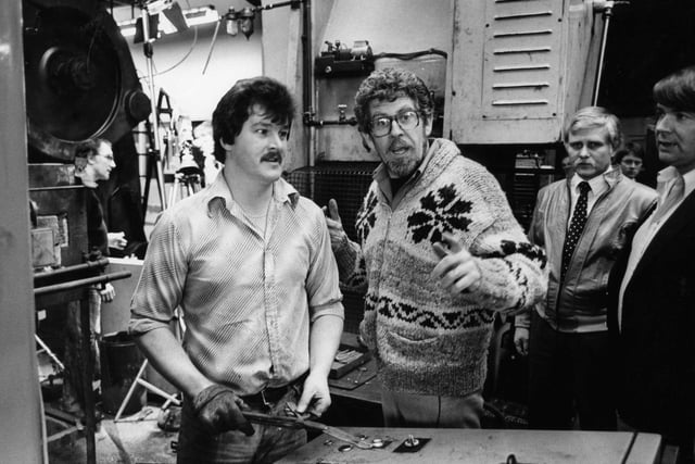 Rolf Harris visits Viners, Sheffield to record a new TV show. Rolf talks to stamper Les Groves.