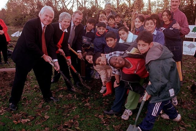 Eddie Healey, Jan Wilson and Richard Caborn MP, help kids at Tinsley Junior school to plant trees to help cut down noise and pollution from the M1, November 1998