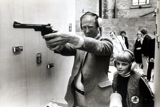 Jack Charlton opens new gun range.
Pic shows Jack in action, with 11 year old Paul Johnson (son of the Managing Director) looking on.
Filed May 13 1982