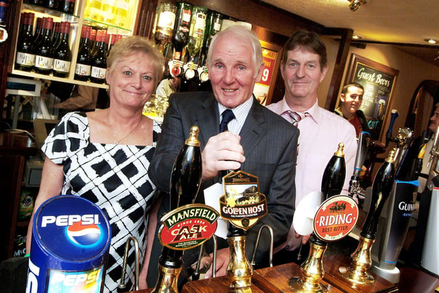 Stags legend Sandy Pate, pulls the first pint in the newly refurbished Ling Forest Pub watched by Landlord and Lady, John and Kath Morritt in 2010