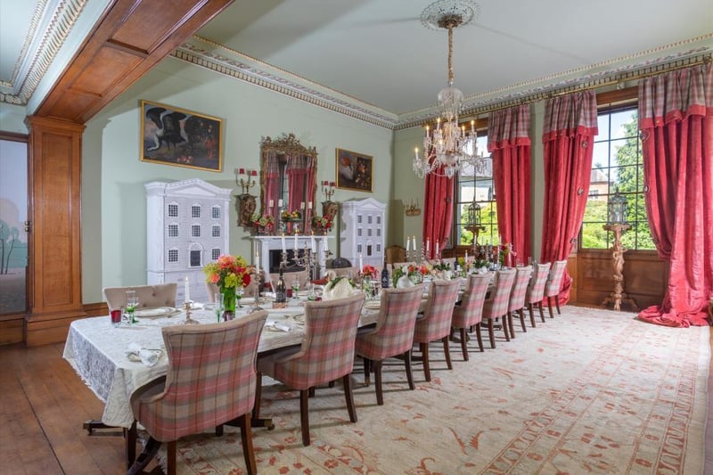 The dining room is highly impressive with the ability to host large parties if required. There is a beautiful depiction across one wall of a classic Georgian townscape and to one side is a log burner with a marble mantel piece.