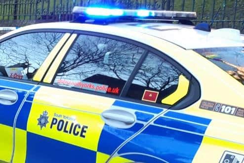 File picture shows a police car attending an incident in Sheffield. Police are appealing for information after an 'indecent act' near Hackenthorpe