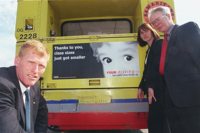 Road safety officers, Mike Stanley (Sheffield), Sandra Crofts (Rotherham) and Peter Oliver (Doncaster) pictured in 1999 with one of the new road safety posters on the back of a bus at the Mainline depot, Olive Grove.