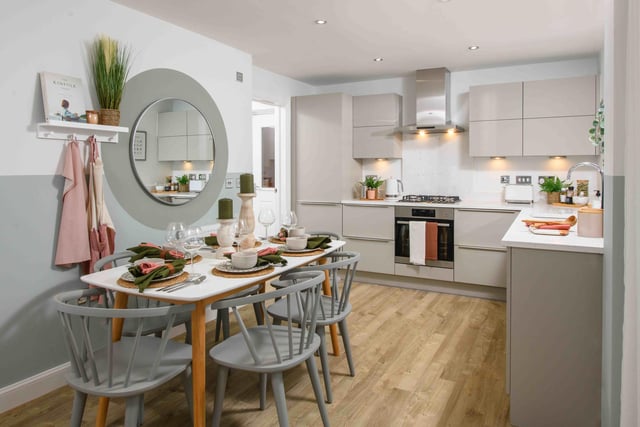 The open plan kitchen with dining areas in the three bedroom Hadley house.