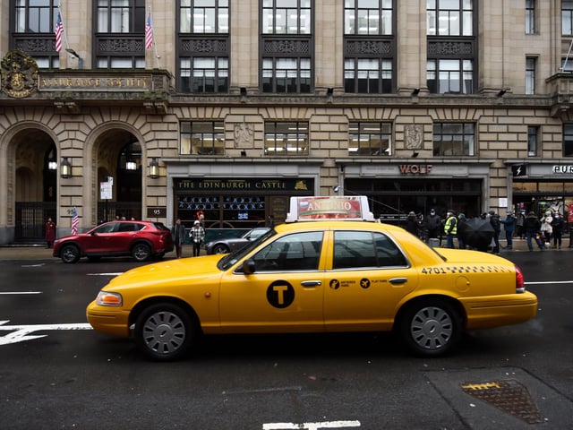 Glasgow stands in for the city of Chicago , yellow taxis cab