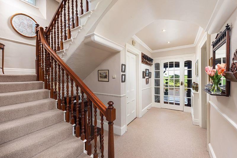 The bright and airy hallway links rooms downstairs and leads up to the first floor, with a cloakroom and WC downstairs.