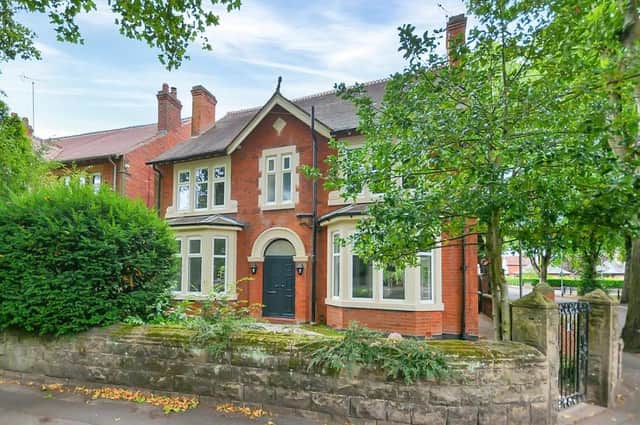 A stunning renovation has transformed this Edwardian building into a modern family home in an attractive location. A stone-walled front includes a wrought-iron gate that leads into a front garden with mature shrubs and plants.