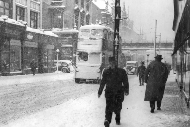 A blizzard hit King Street in December 1950 as this scene shows.