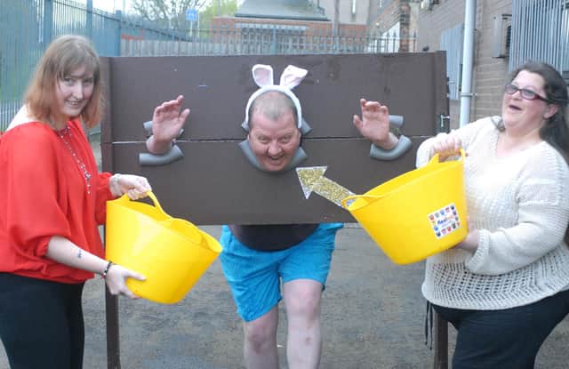 Easter fun at at Arts 4 Wellbeing where  Dave Wood is in the stock and getting a right soaking. Remember this?