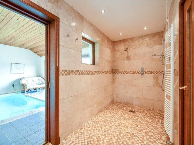 The swimming pool has its own shower room.