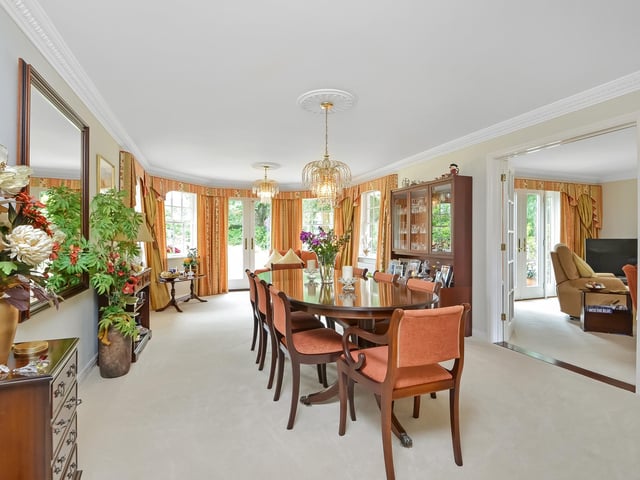 The dining room on the ground floor has bay windows leading to the back garden.