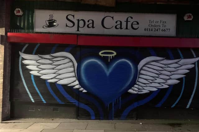 The shutters of the family cafe have been painted in Alfie Hague's memory