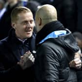 Owls boss Garry Monk embraces Manchester City manager Pep Guardiola after their FA Cup clash earlier this year.