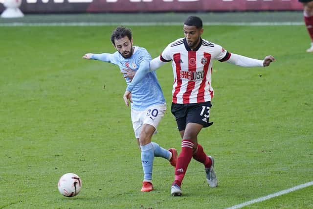 Max Lowe of Sheffield Utd and Bernardo Silva of Manchester City: Andrew Yates/Sportimage