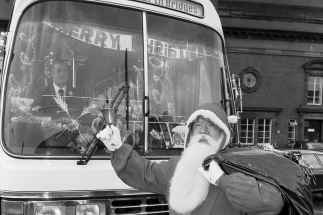 Lothian Region Transport bus driver Willie Combe dressed as Santa to deliver presents to children's homes in the area in December 1980.