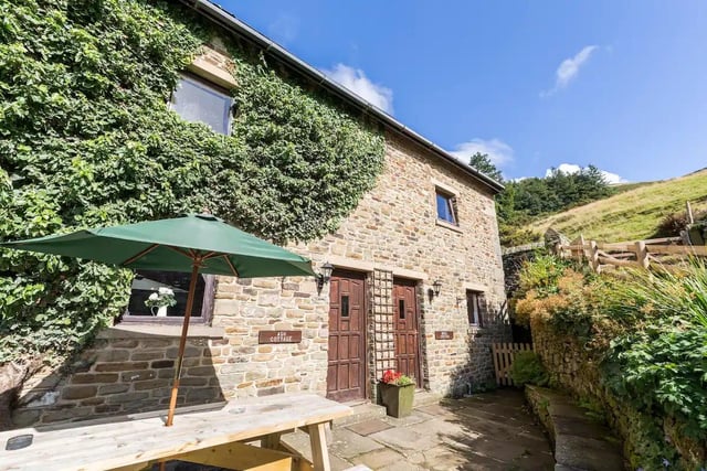 The vine-covered Ash Cottage, located in the Derbyshire Peak District, is like something out of a fairy tale. Photo: Airbnb