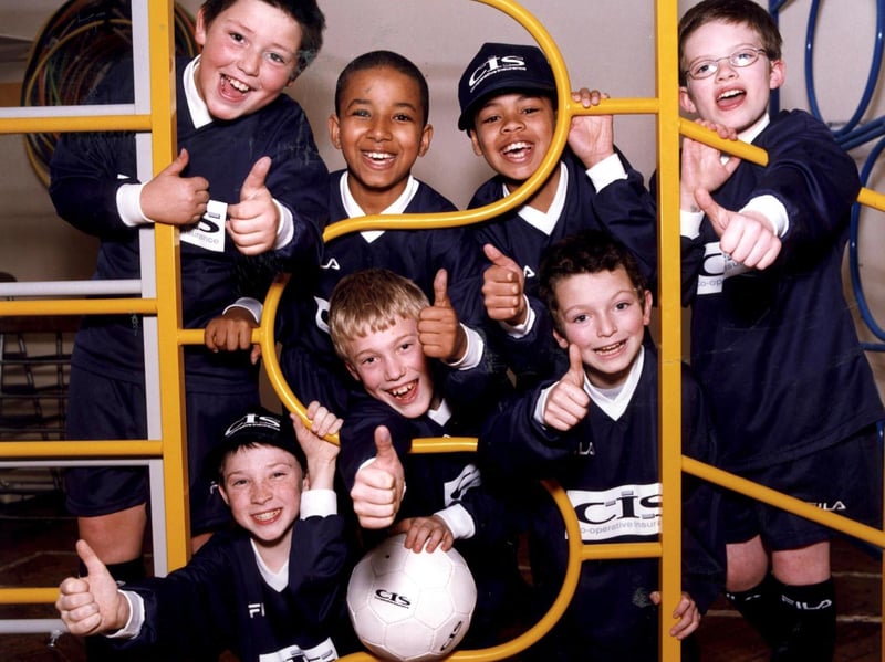 The children of Hunters Bar Junior School give their new football kit the thumbs up on June 27, 2001