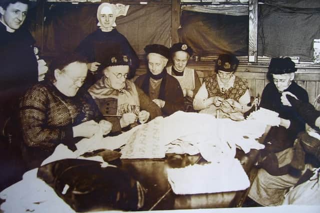 The owner’s aunt, Sister Hildegarde, with residents in the sewing room where they made and repaired items for the home and chapel and also created more decorative textiles.