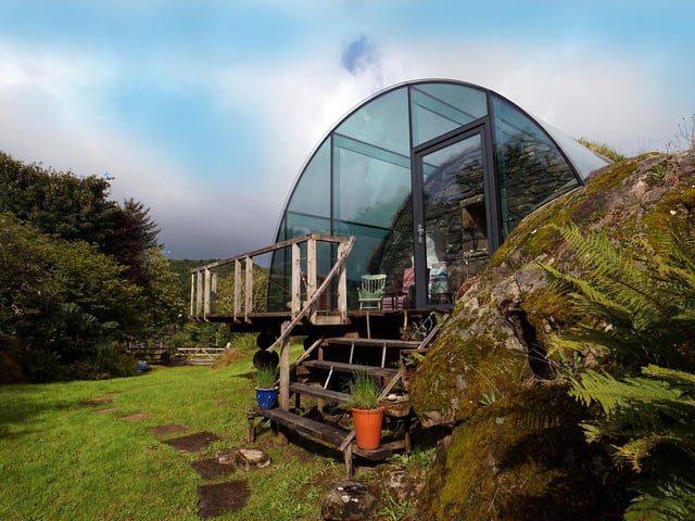 The house has two entrances - through the south-facing light loft or a street-level door way on the north gable