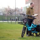 Russell Cutts picking up the Active Practice welcome packs from Tanya Howard at the Advanced Wellbeing Research Centre to deliver by cargo bike