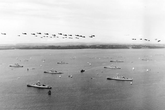 A view over the 1977 Review Fleet with helicopter fly past.