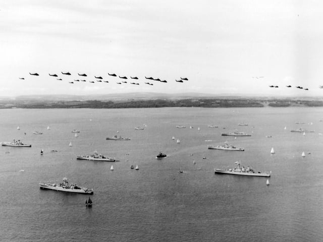 A view over the 1977 Review Fleet with helicopter fly past.
