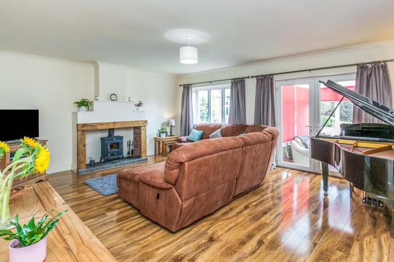 It would be impossible not to relax with your feet up in this lovely lounge. One of its main features is the fireplace with a multi-fuel stove fire, wood surround and tiled hearth, while double-glazed French doors lead into the conservatory.