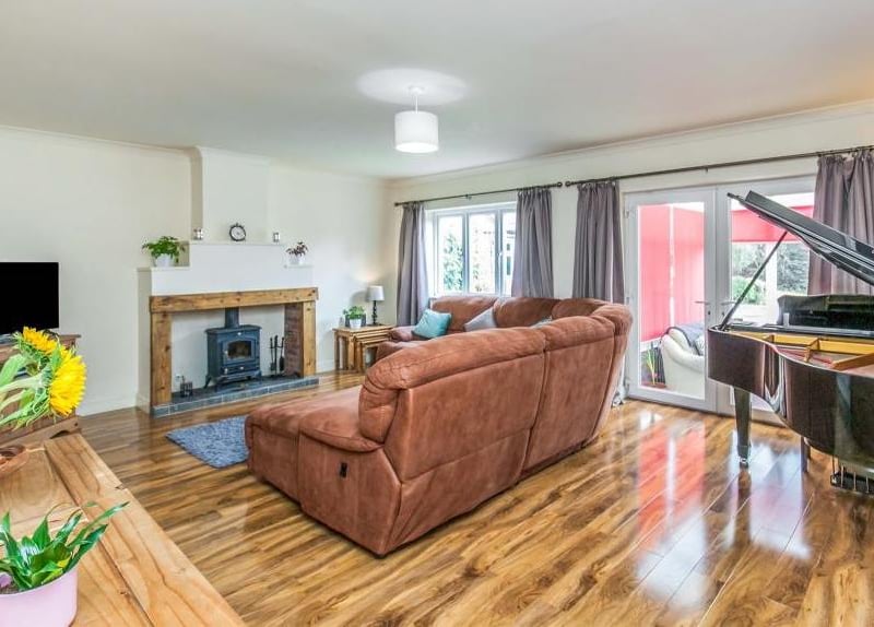 It would be impossible not to relax with your feet up in this lovely lounge. One of its main features is the fireplace with a multi-fuel stove fire, wood surround and tiled hearth, while double-glazed French doors lead into the conservatory.