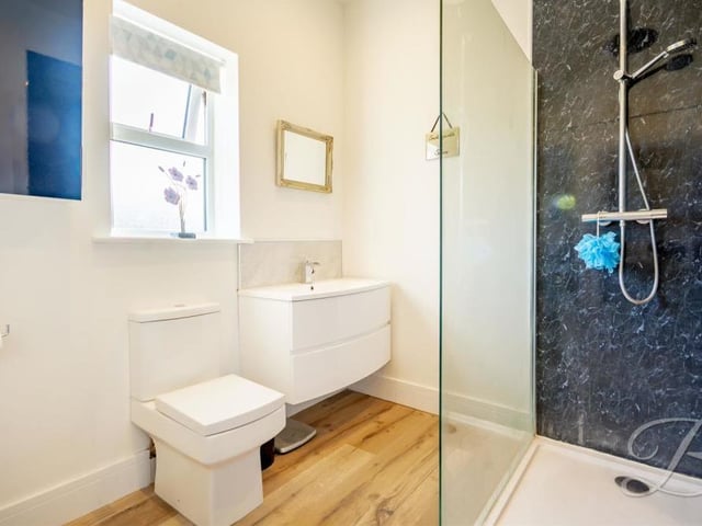 The second en suite is possibly even more attractive than the first. The facilities are the same, complete with another enclosed shower.