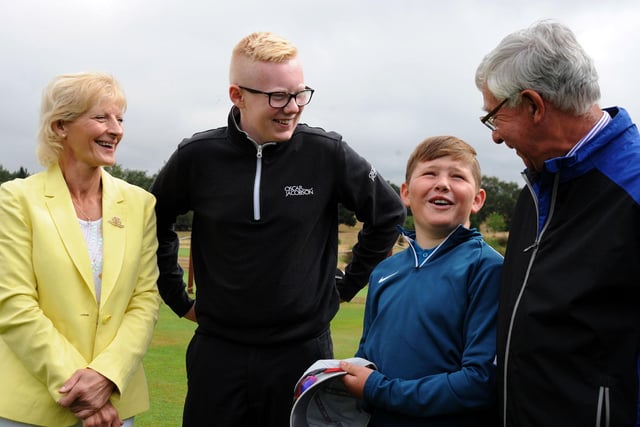 Worksop Golf Club Captain, Mick Bower, and Lady Captain, Angela Burrows, chat with their junior captain, Jack Freeman, second left, and Oliver Neal before teeing off.