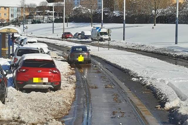 Bus and tram routes and roads have suffered major disruption again today as the snow causes chaos across Sheffield.. This picture shows a tram route blocked by an abandoned car. PIcture: Stagecoach
