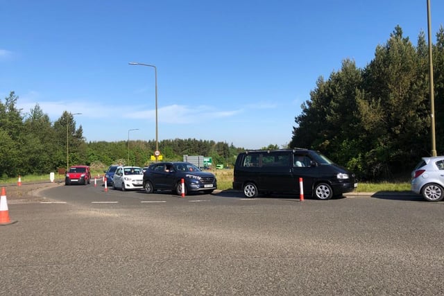 Cars queuing for the centre have backed up onto the A71 past the roundabout.