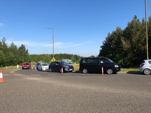 Cars queuing for the centre have backed up onto the A71 past the roundabout.