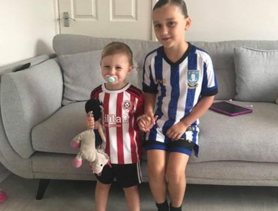Wednesday fan Ivy, seven, with her Blades-supporting sister, Nellie, who is three.