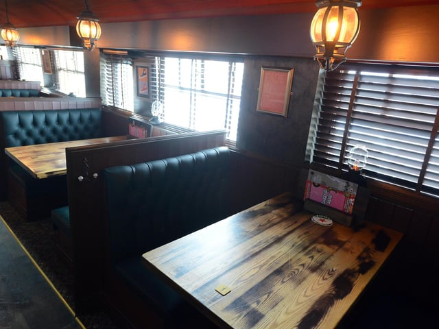 Booths are ready to welcome diners.