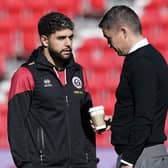 Sheffield United's Reda Khadra chats to Paul Heckingbottom before the Sky Bet Championship match against Stoke City at The Bet365 Stadium. Andrew Yates / Sportimage