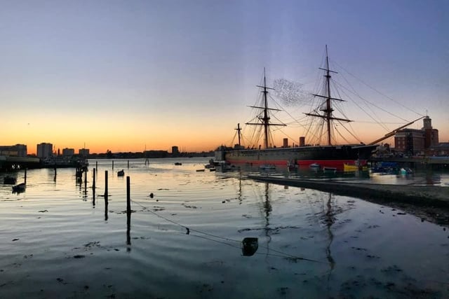 We leave you with this wonderfully calm view of HMS Warrior. The harbour is so still, as a murmuration of starlings fly between the ship's masts.