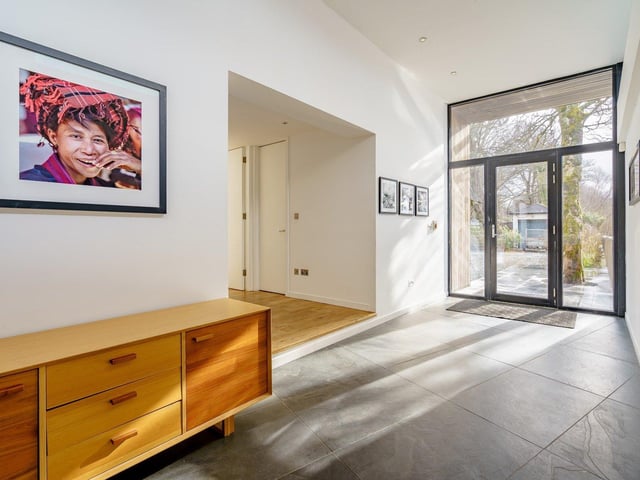 The bright hallway leads to the bedrooms downstairs.
