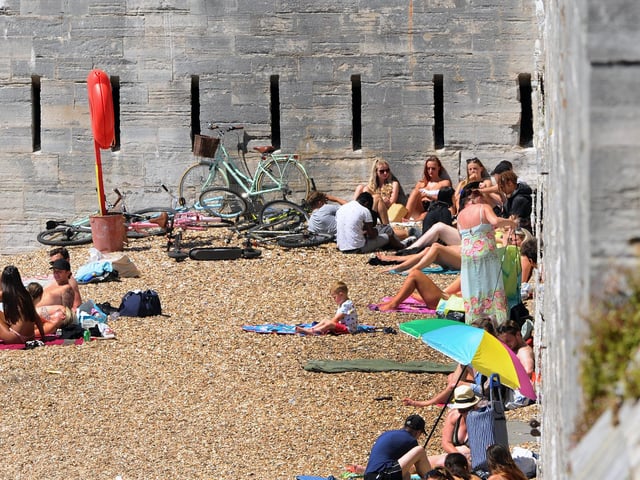 People flocked to the Hot Walls in Old Portsmouth on Thursday, May 21 - the hottest day of the year. Picture: Sarah Standing (210520-2433)