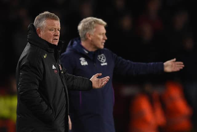 Sheffield United's manager Chris Wilder (L) gestures on the touchline  next to West Ham's David Moyes: OLI SCARFF/AFP via Getty Images