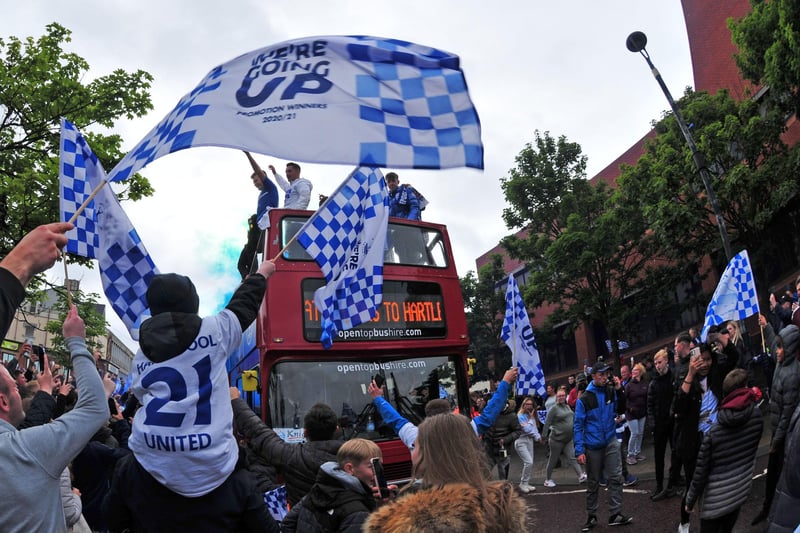 Fans celebrated Hartlepool United's promotion at the Civic Centre as the bus arrived.