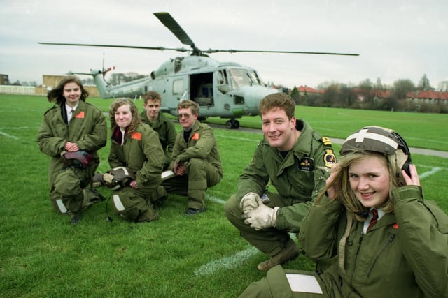 A career lesson from the Royal Navy at the school in 1993. Pictured are Joanne Parkin, 14, with pilot Iain Banks; and Suzanne Fisher, 15, and Claire Wood, 14 with mechanics Ian Willey and Adrian Parsons.