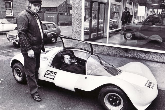 Picture shows a racing car designed and built in Sheffield.  On the left is Tony Shaw, an assistant parts manager at a Sheffield garage, and Martin Reed, a draughtsman with a city firm.  These two, in conjunction with Trevor Hegarty, designed and built the car which will run in its first race in March 1975.