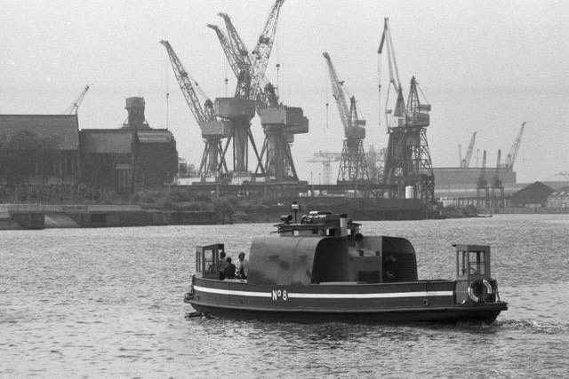 The Kelvinhaugh ferry crosses the River Clyde in Glasgow, June 1980 - it would cease providing the service in the same year after over a hundred years of carrying passengers across the Clyde.