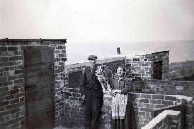 Pictured are Mary and Billy Furniss and their dog in the pig sties behind Wincobank Castle.
Submitted by Mrs Mary Furniss